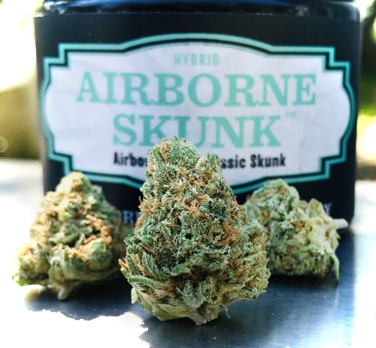 three buds of airborne skunk with evermore container behind