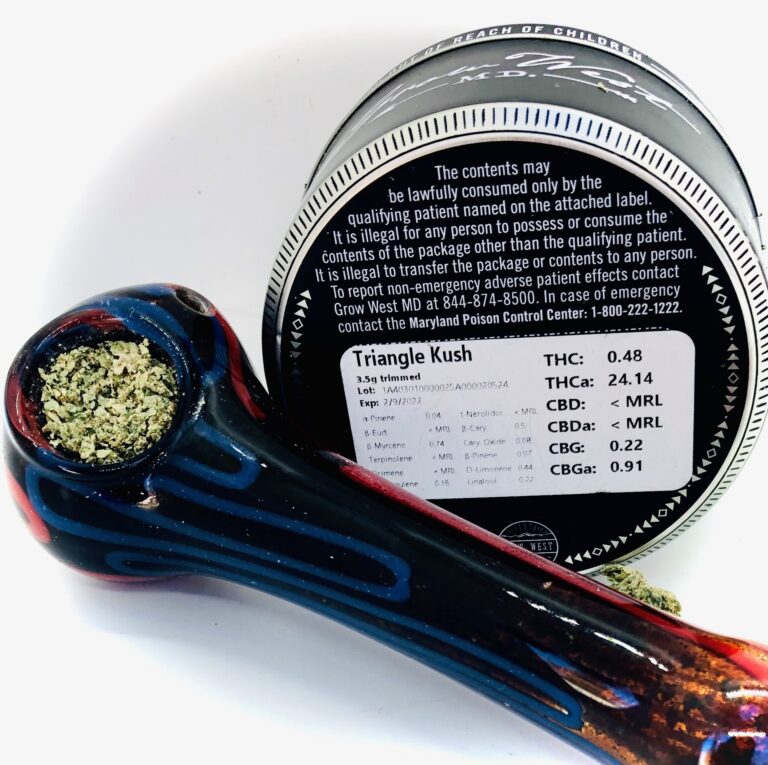 glass pipe packed with triangle kush by grow west next to grow west container showing testing label
