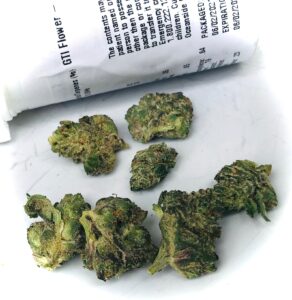 buds of cookie face in front of white pre pack bottle