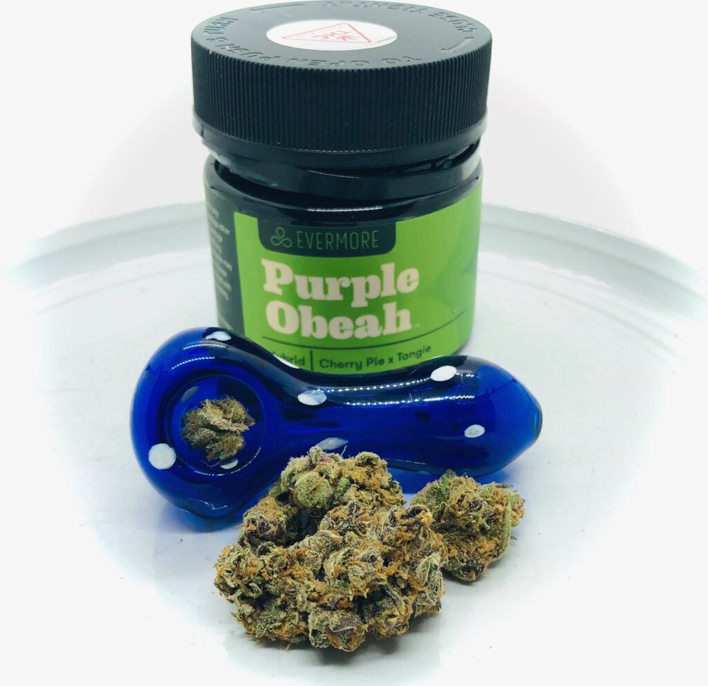 purple obeah buds in front of cobalt blue glass spoon bowl in front of evermore jar